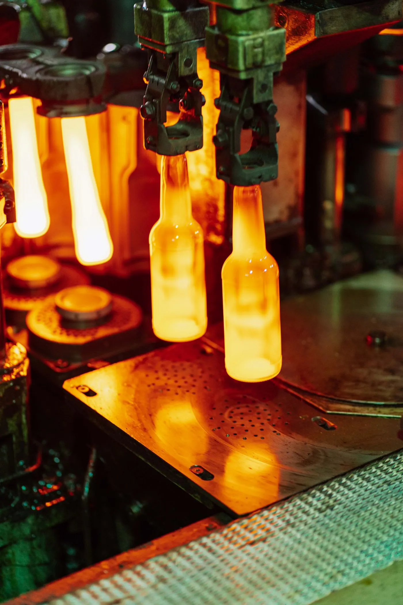 Glass bottles being moulded